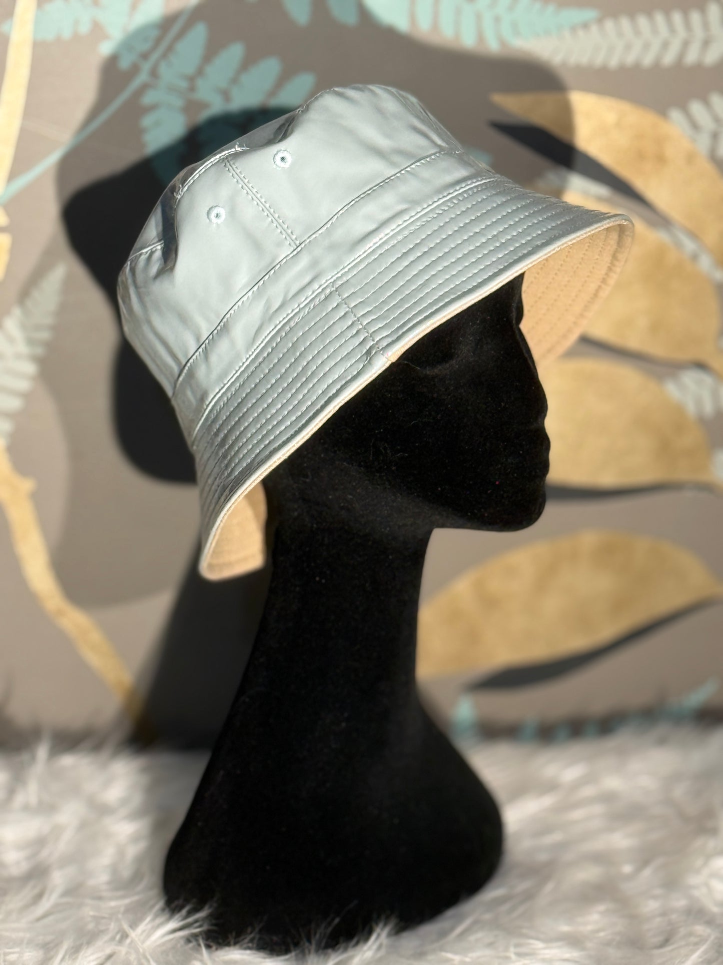 Cappello da pioggia reversibile azzurro/beige